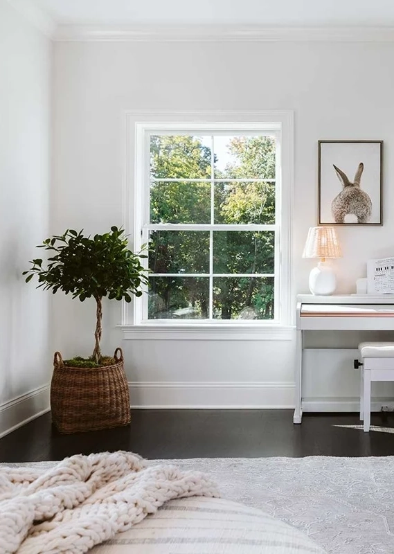 a cute bedroom with a bright window